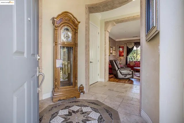 a view of living room filled with furniture and wooden floor