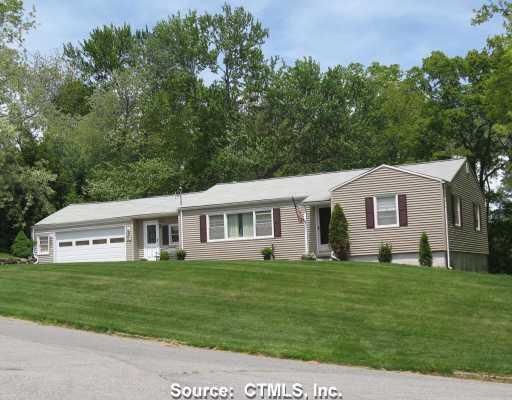 9 Sentinel Hill Road Milford, CT 06460 - Photo 1 of 1 a front view of a house with a yard