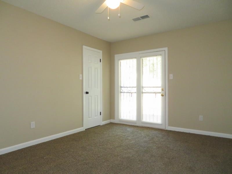 4207 Hickory Grove Road Memphis, TN 38141 - Photo 4 of 7 an empty room with a window