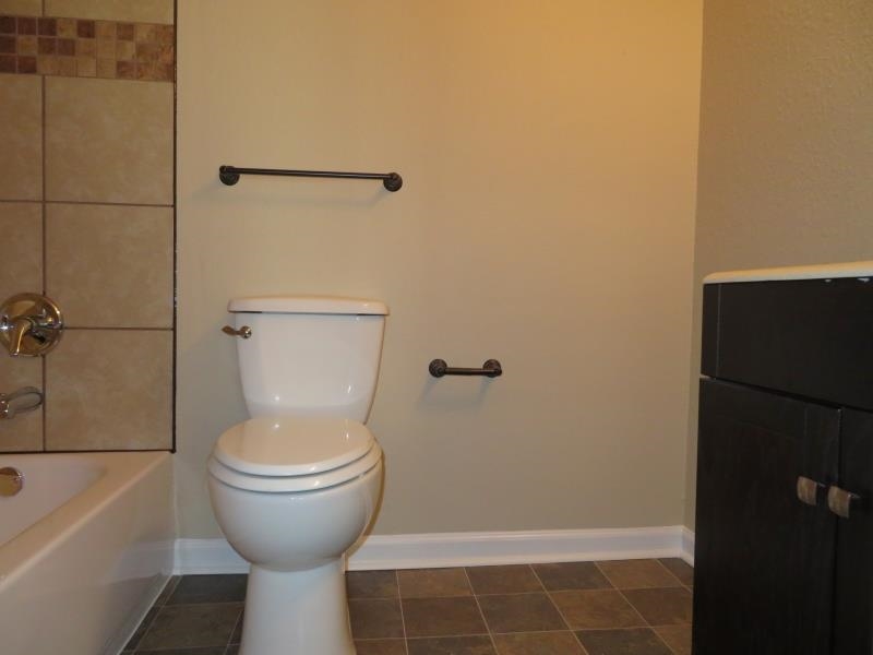 4207 Hickory Grove Road Memphis, TN 38141 - Photo 5 of 7 a bathroom with a toilet and a shower