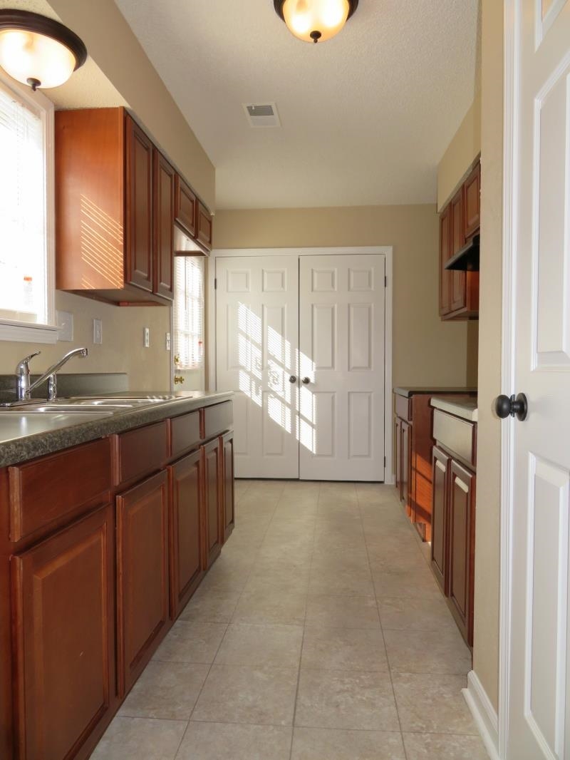 4207 Hickory Grove Road Memphis, TN 38141 - Photo 6 of 7 a bathroom with a sink a mirror and a bathtub
