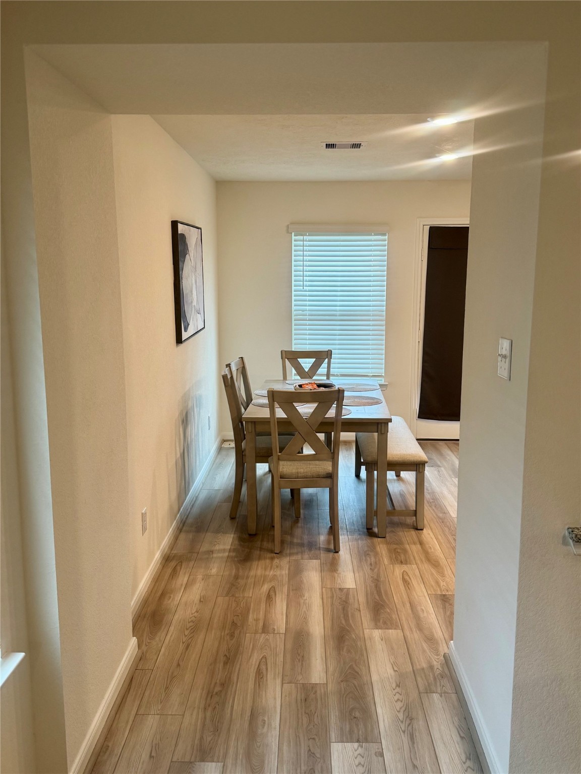 3015 Kalimera Lane Fresno, TX 77545 - Photo 2 of 15 a view of a dining room with furniture and wooden floor