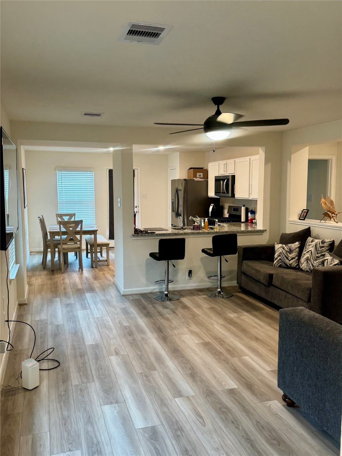 3015 Kalimera Lane Fresno, TX 77545 - Photo 3 of 15 a living room with furniture and a wooden floor