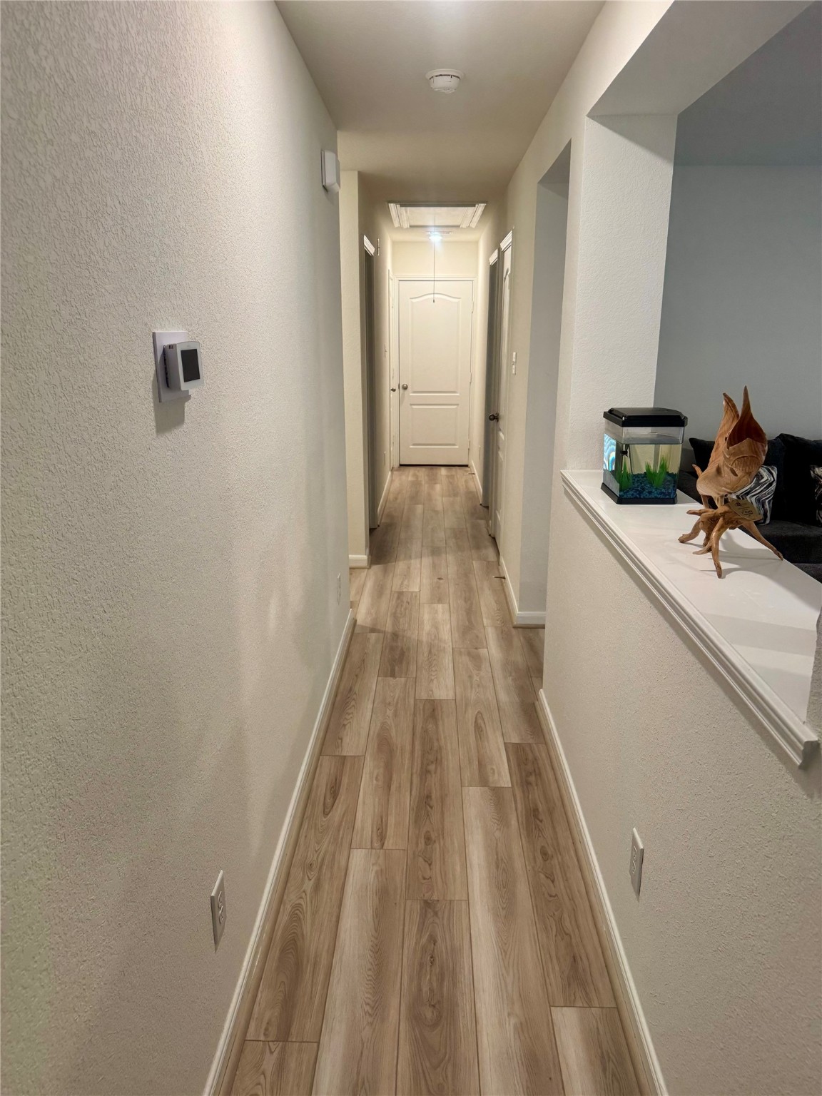 3015 Kalimera Lane Fresno, TX 77545 - Photo 6 of 15 a view of a hallway with wooden floor and staircase