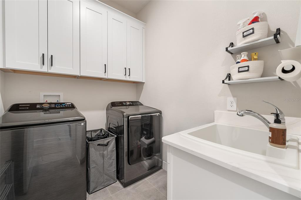 10175 Brocksport Circle Gotha, FL 34734 - Photo 27 of 54 a utility room with dryer and washer