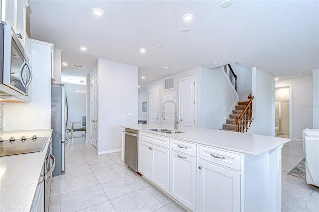 a view of kitchen with dining table and chairs