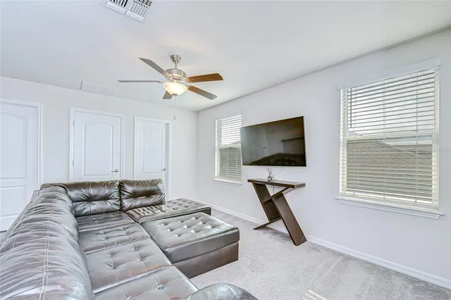 a view of a house with yard and porch