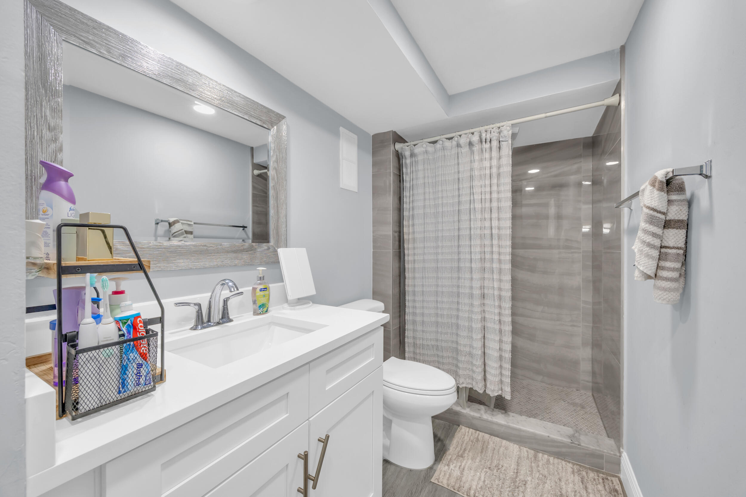 470 Northwest 20th Street, Unit 1050 Boca Raton, FL 33431 - Photo 18 of 28 a bathroom with a sink toilet and shower