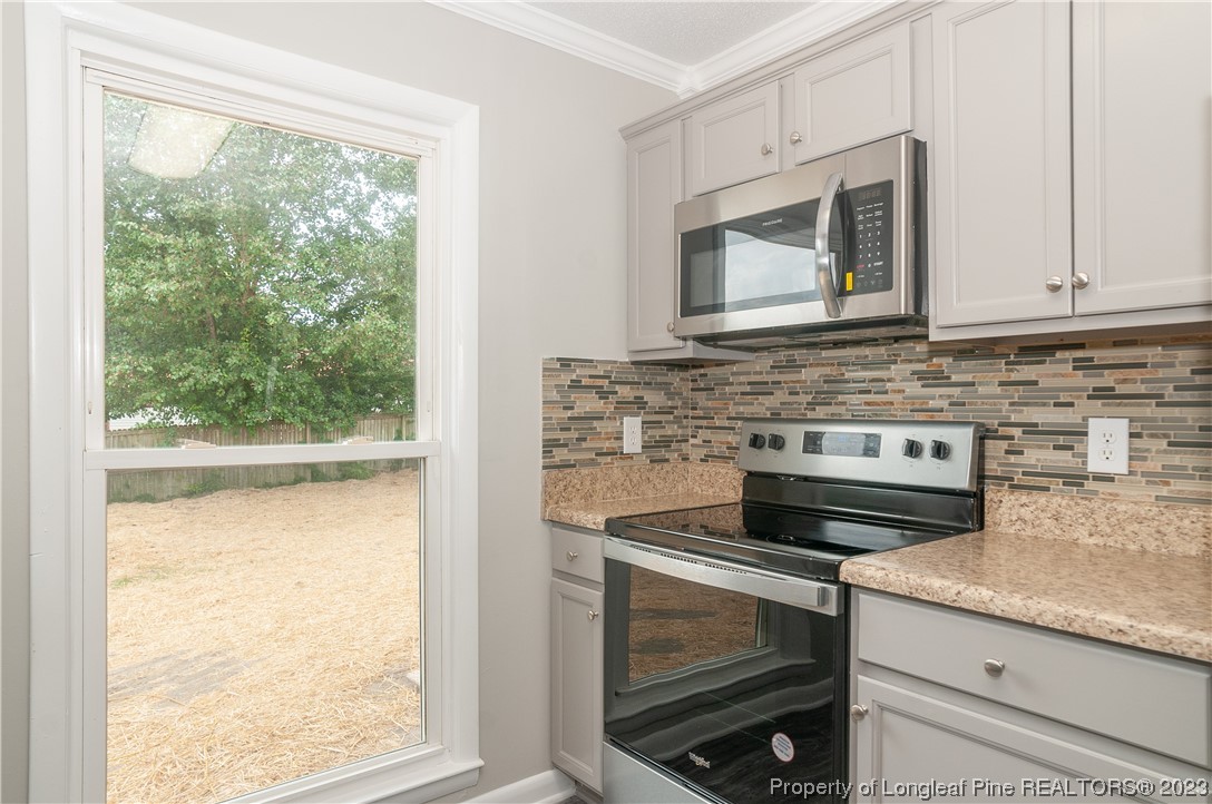 3313 Red Fox Road Spring Lake, NC 28390 - Photo 13 of 33 a stove top oven sitting inside of a kitchen