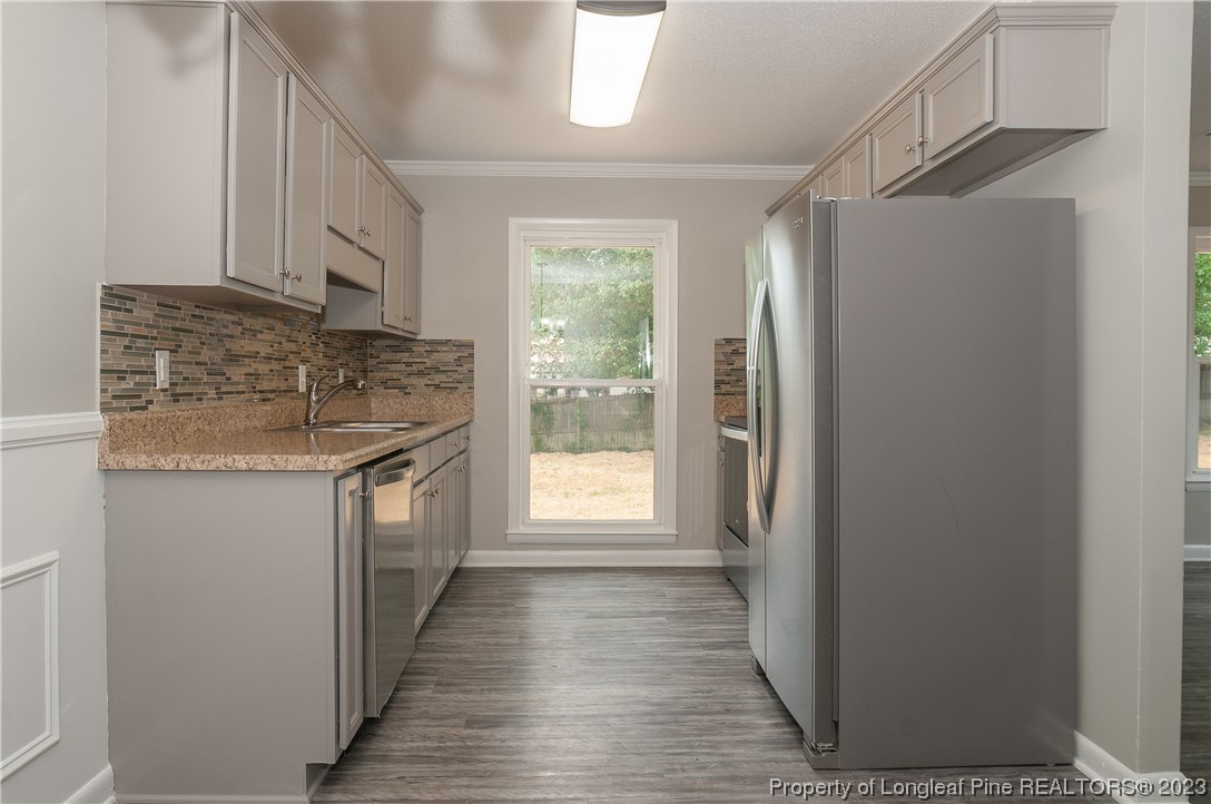 3313 Red Fox Road Spring Lake, NC 28390 - Photo 15 of 33 a kitchen with stainless steel appliances granite countertop a refrigerator and a sink