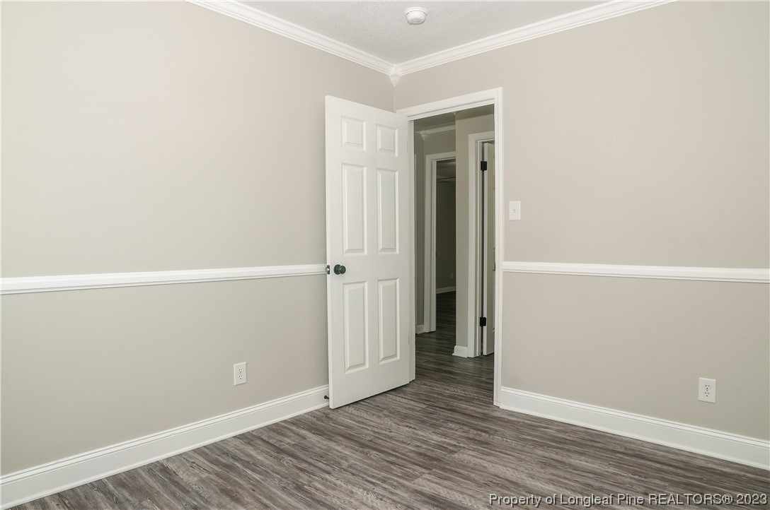 3313 Red Fox Road Spring Lake, NC 28390 - Photo 17 of 33 an empty room with wooden floor