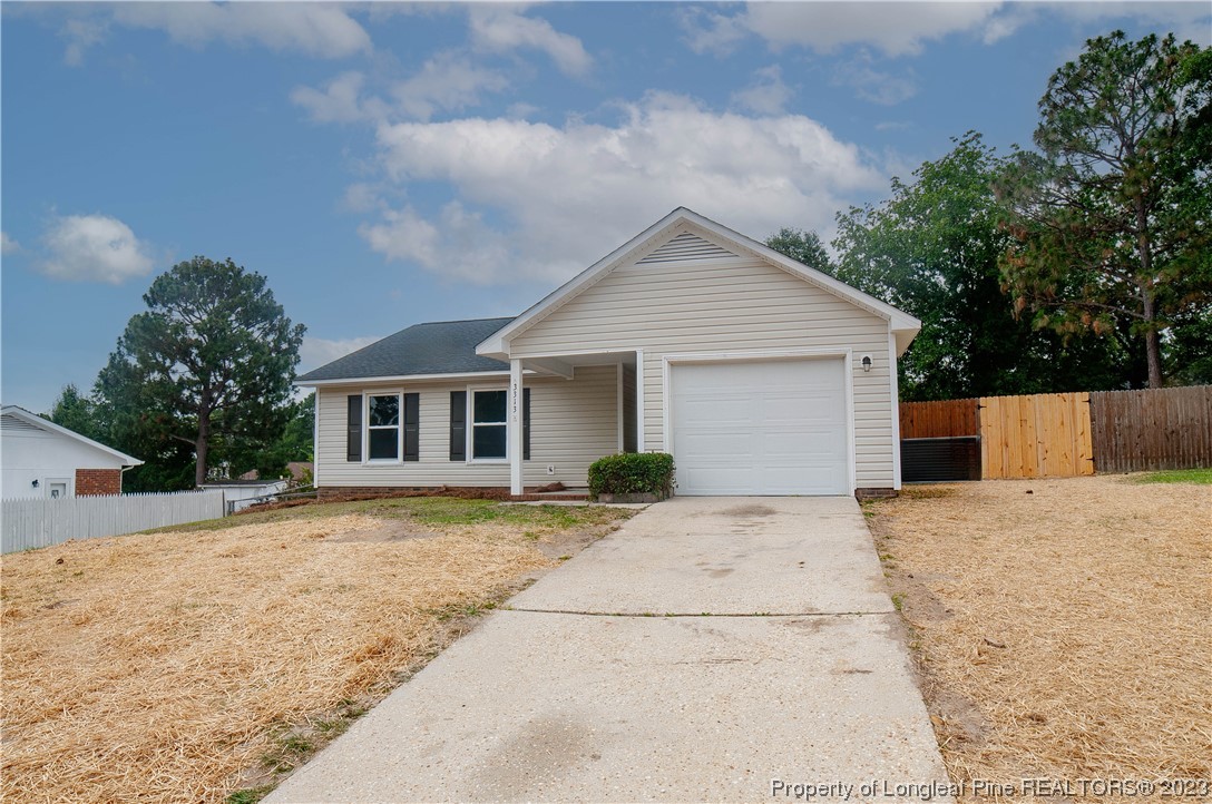 3313 Red Fox Road Spring Lake, NC 28390 - Photo 2 of 33 a view of a house with a yard and large tree