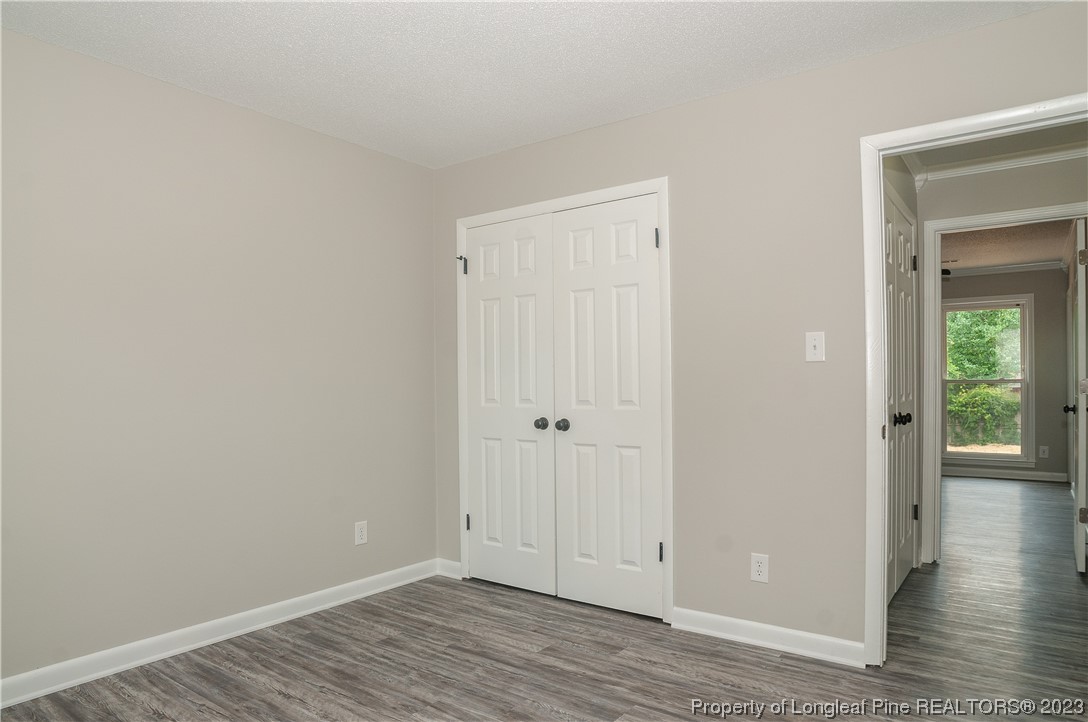 3313 Red Fox Road Spring Lake, NC 28390 - Photo 22 of 33 a view of an empty room with wooden floor