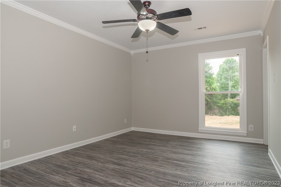 3313 Red Fox Road Spring Lake, NC 28390 - Photo 23 of 33 wooden floor in an empty room with a window