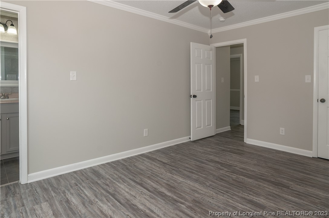 3313 Red Fox Road Spring Lake, NC 28390 - Photo 25 of 33 a view of an empty room with wooden floor