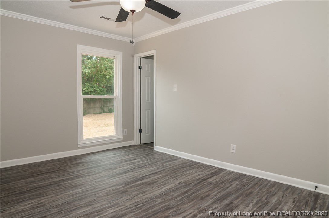 3313 Red Fox Road Spring Lake, NC 28390 - Photo 26 of 33 wooden floor in an empty room with a window