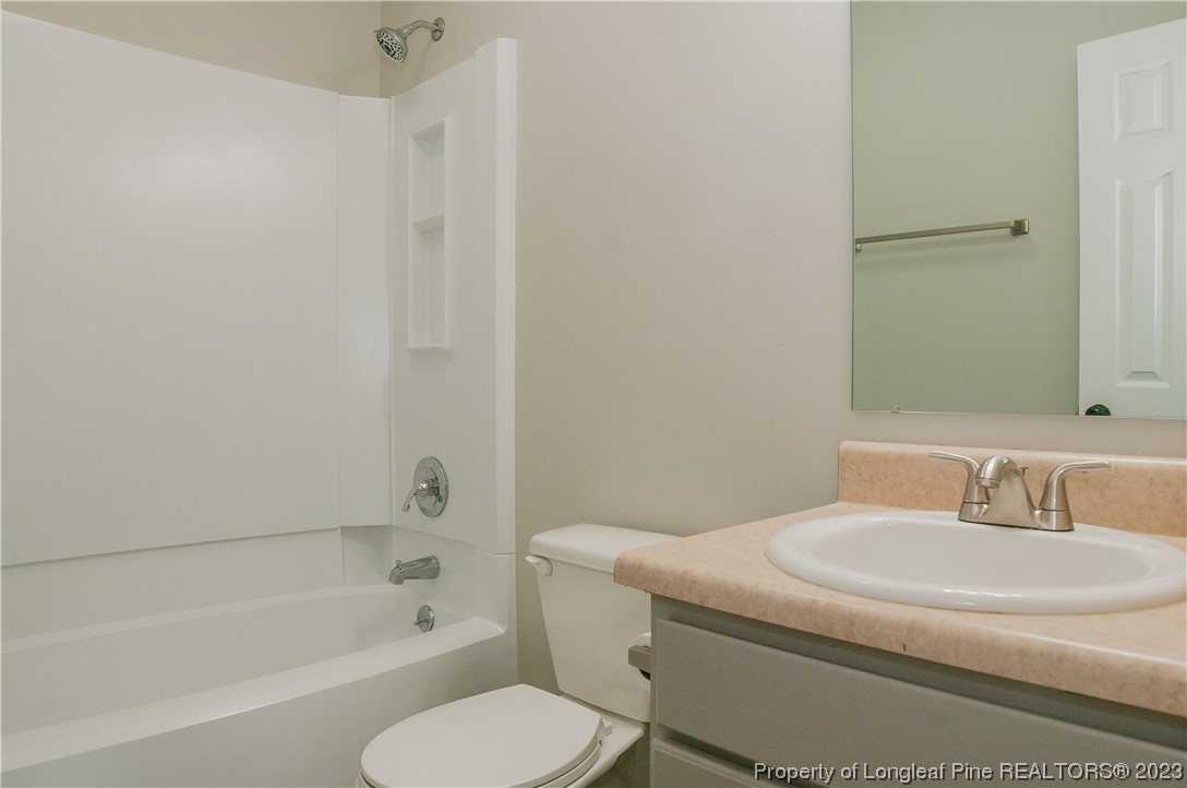 3313 Red Fox Road Spring Lake, NC 28390 - Photo 30 of 33 a bathroom with a sink toilet and bathtub