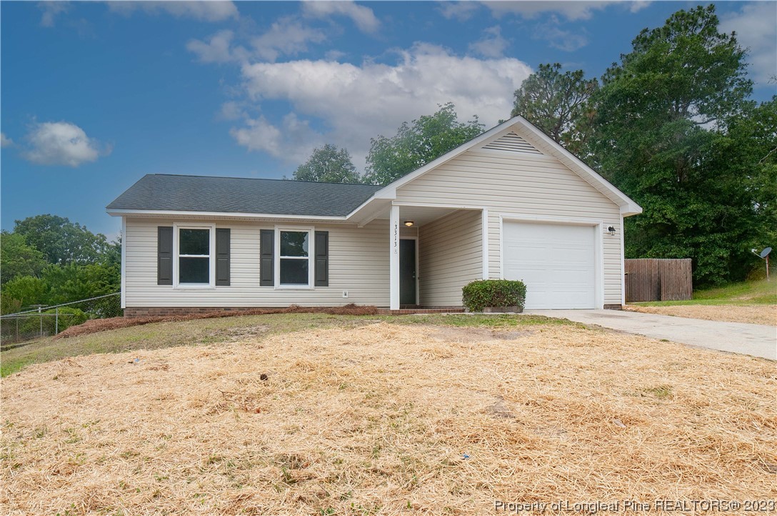 3313 Red Fox Road Spring Lake, NC 28390 - Photo 3 of 33 a front view of a house with a yard