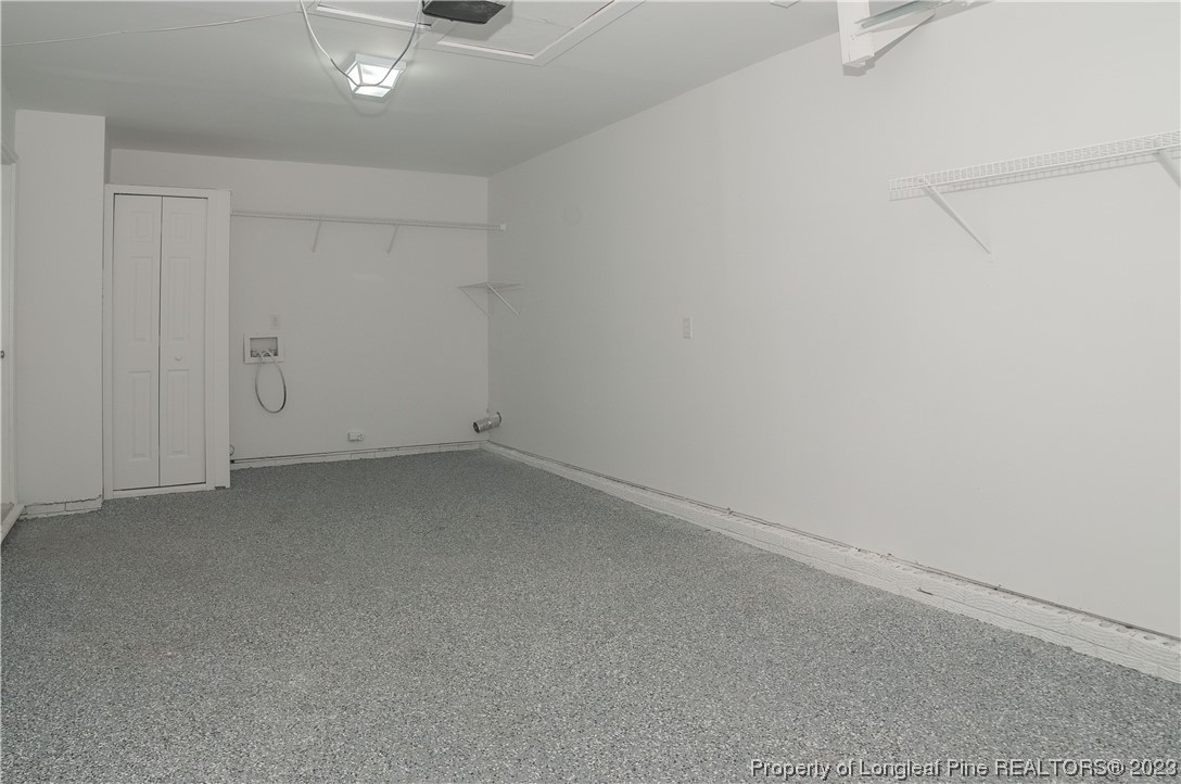 3313 Red Fox Road Spring Lake, NC 28390 - Photo 31 of 33 an empty room with a ceiling fan and window