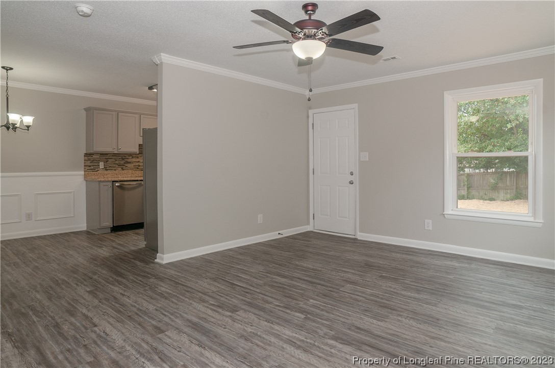 3313 Red Fox Road Spring Lake, NC 28390 - Photo 6 of 33 wooden floor in an empty room with a window