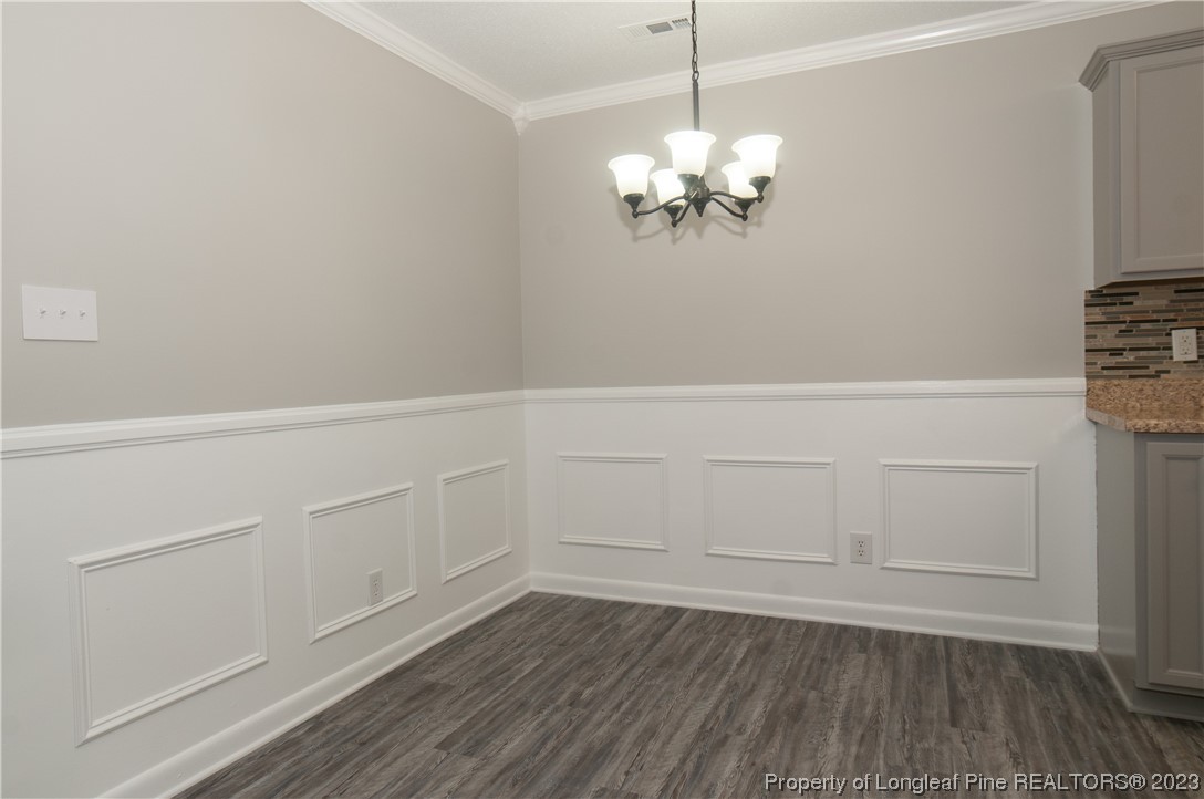 3313 Red Fox Road Spring Lake, NC 28390 - Photo 10 of 33 a view of a room with wooden floor and cabinets