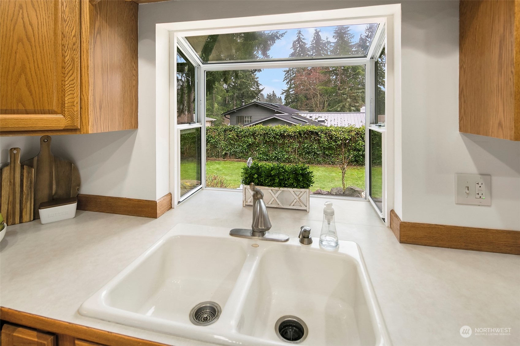 102 217th Place Southwest Bothell, WA 98021 - Photo 17 of 32 a bathroom with a tub a sink and a large window