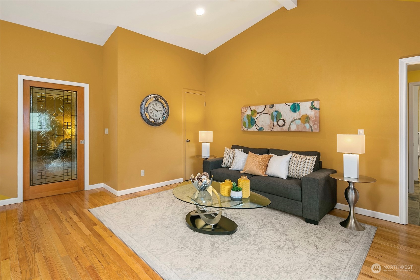 102 217th Place Southwest Bothell, WA 98021 - Photo 23 of 32 a living room with furniture and wooden floor