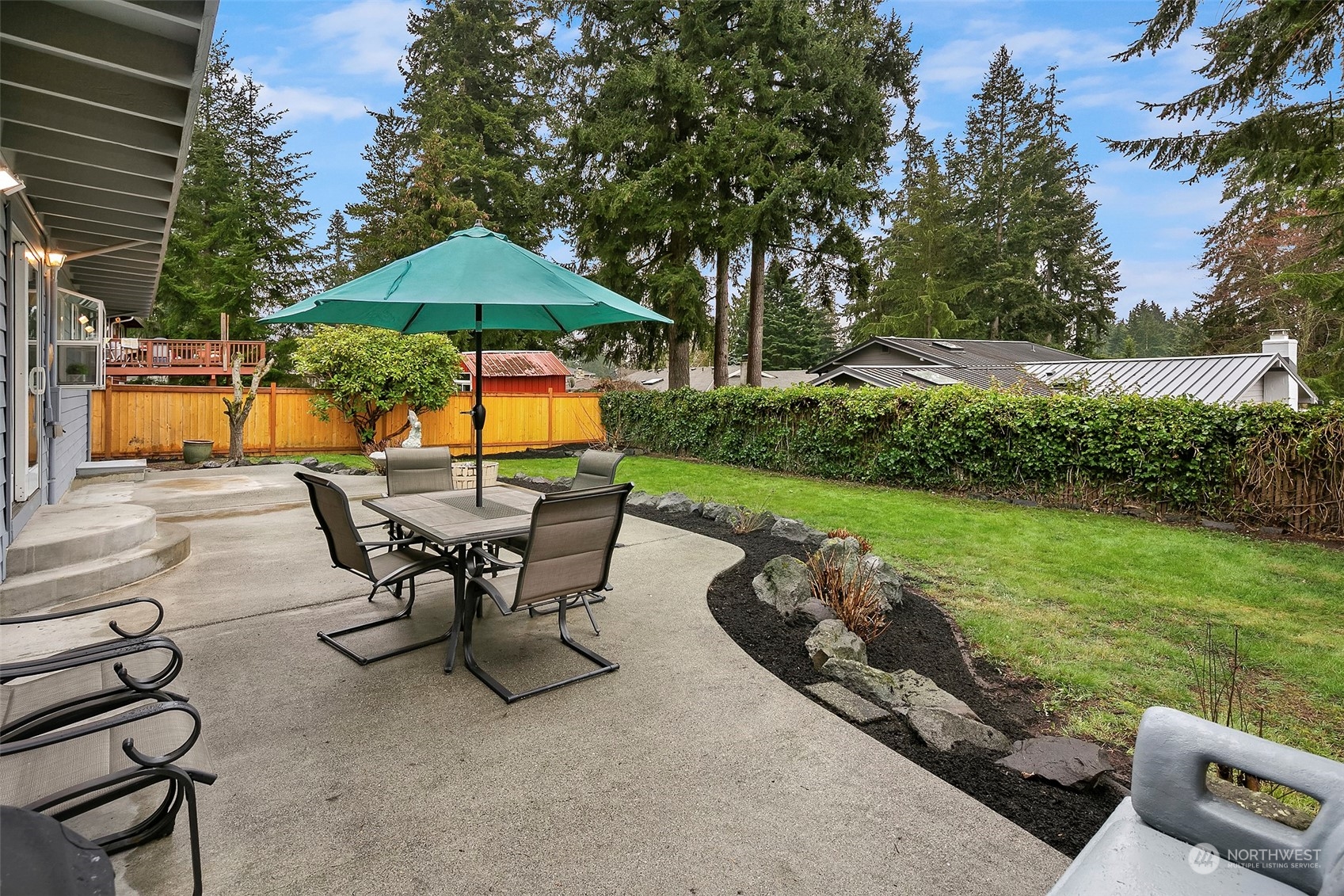 102 217th Place Southwest Bothell, WA 98021 - Photo 8 of 32 an outdoor sitting area with chairs and fire pit