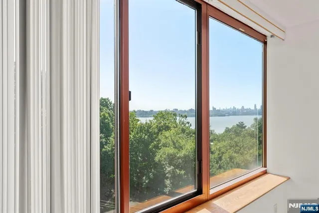 a view of a room that has a large window