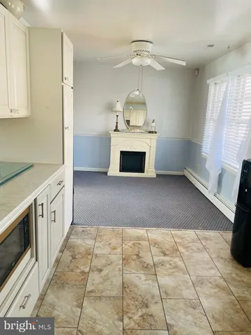 a view of walk in closet with wooden floor