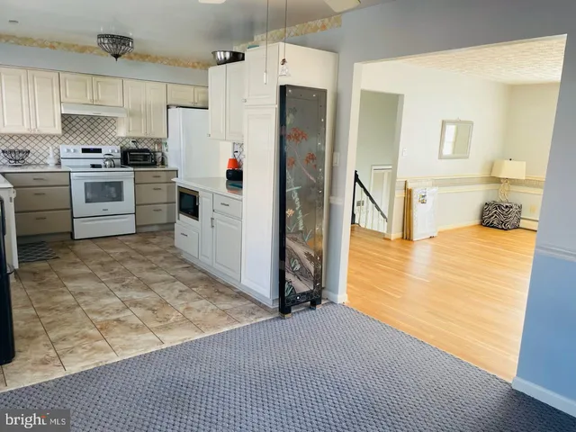 a front view of a house with plants