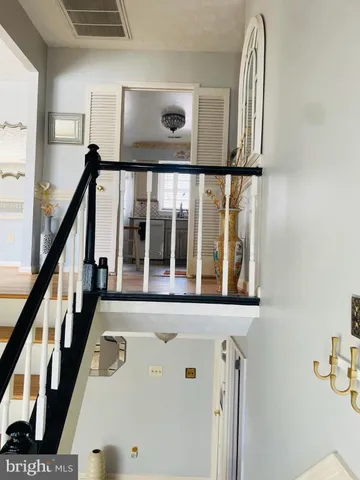 a view of a house with backyard porch and sitting area