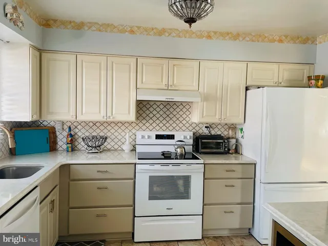 a view of a room with wooden floor and cabinet