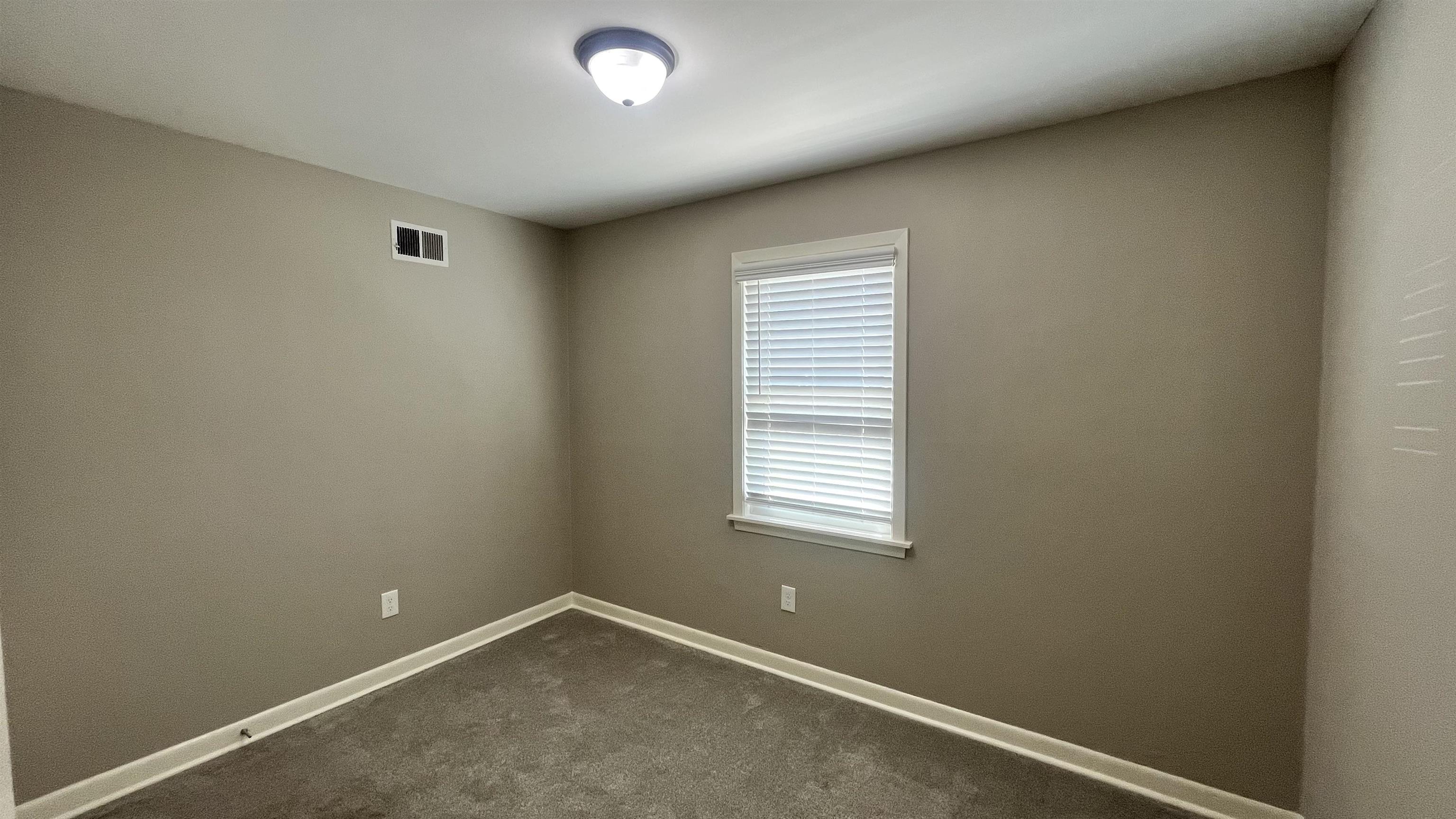 121 West Street Collierville, TN 38017 - Photo 6 of 16 an empty room with a window