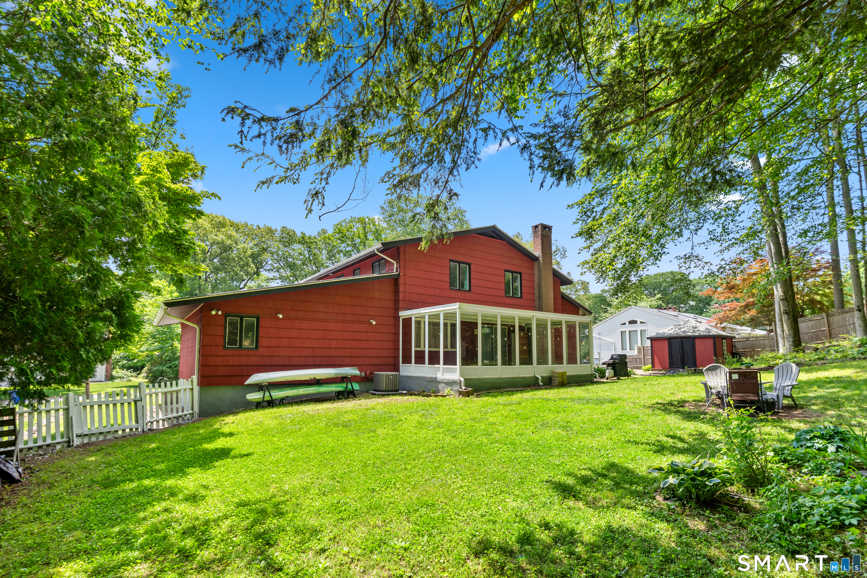 107 Round Hill Road Wethersfield, CT 06109 - Photo 33 of 40 a view of a house with a yard and sitting area