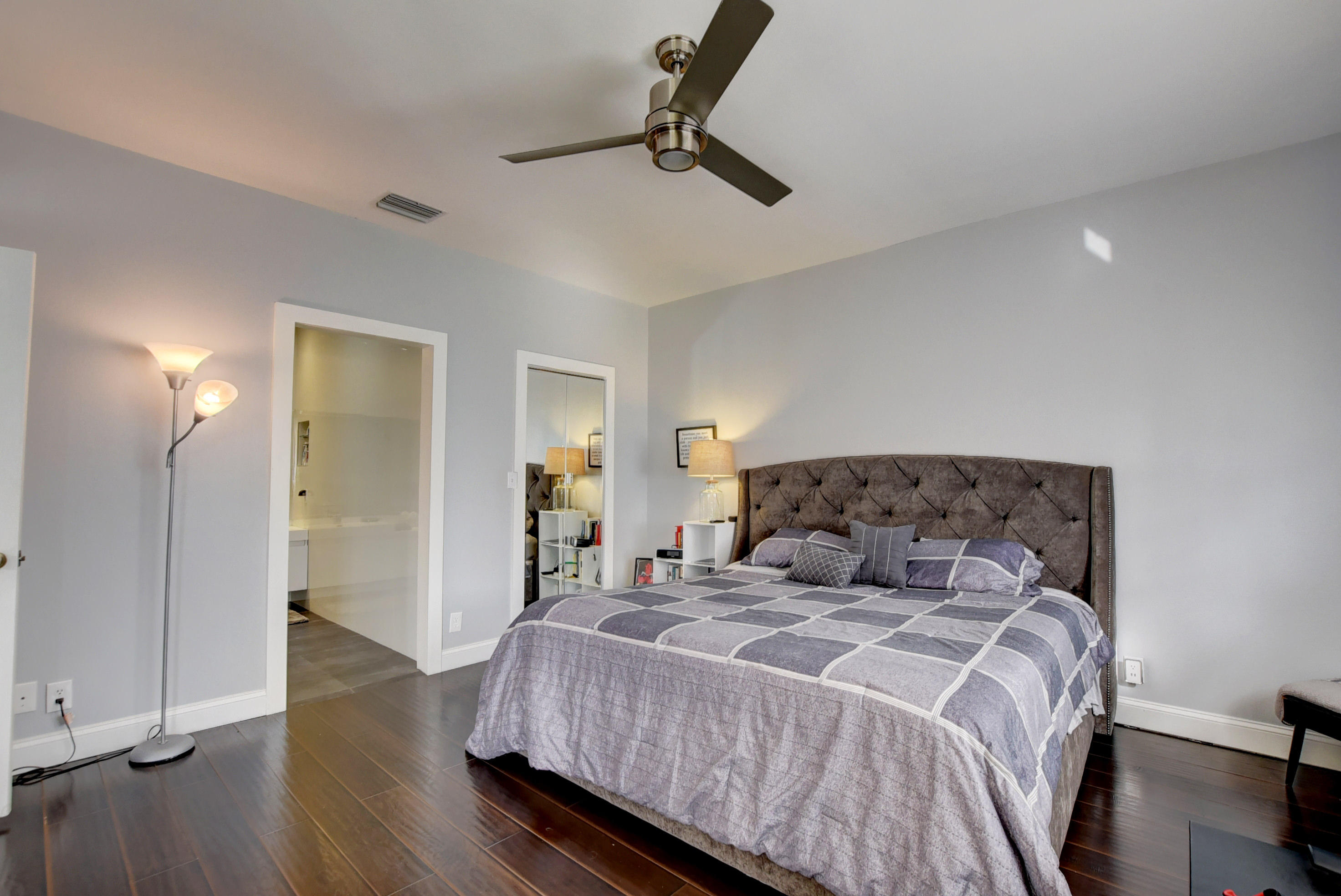 8682 Vía Reale, Unit 4 Boca Raton, FL 33496 - Photo 16 of 51 a bedroom with a bed and dresser