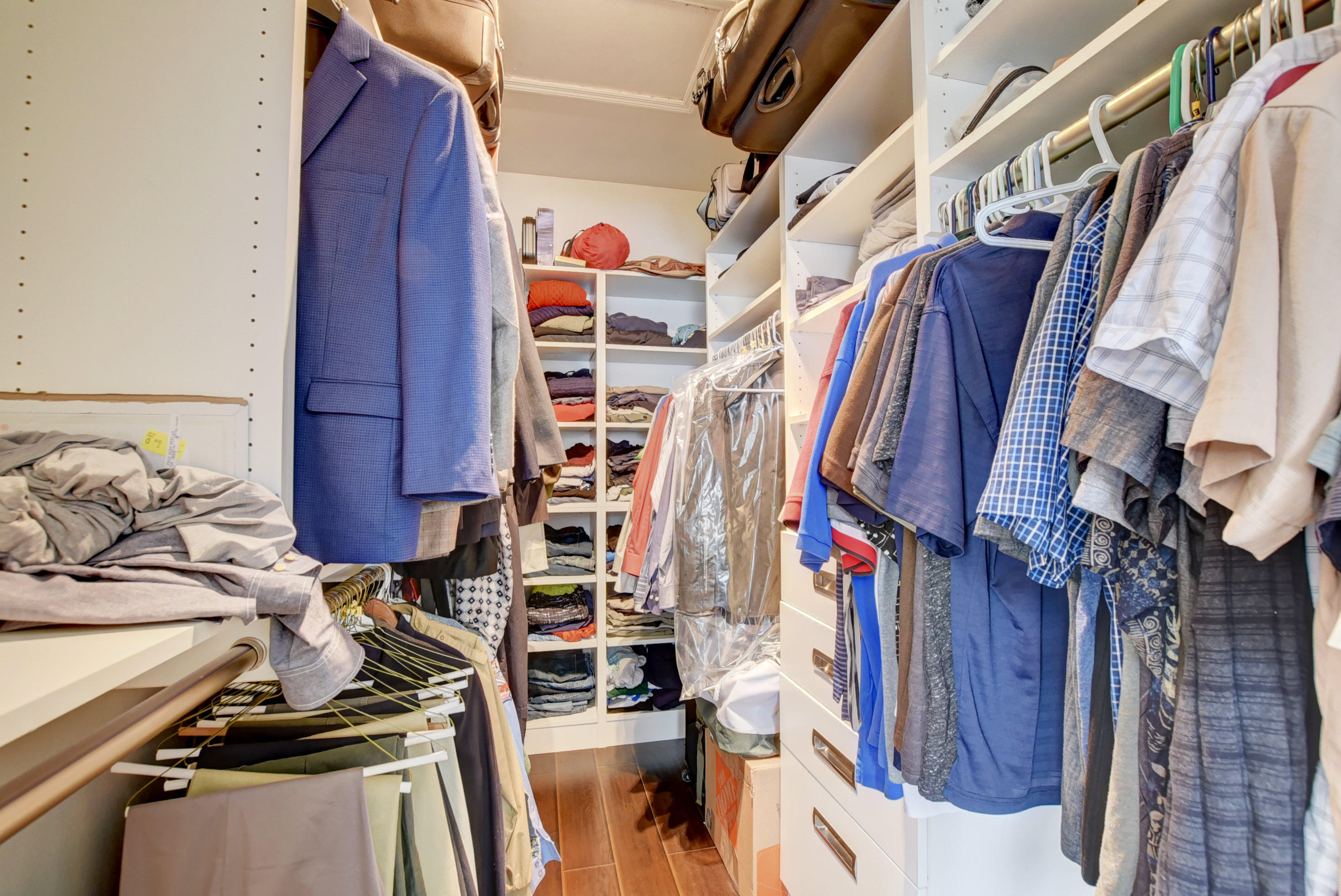 8682 Vía Reale, Unit 4 Boca Raton, FL 33496 - Photo 19 of 51 a view of walk in closet with clothes and shoes