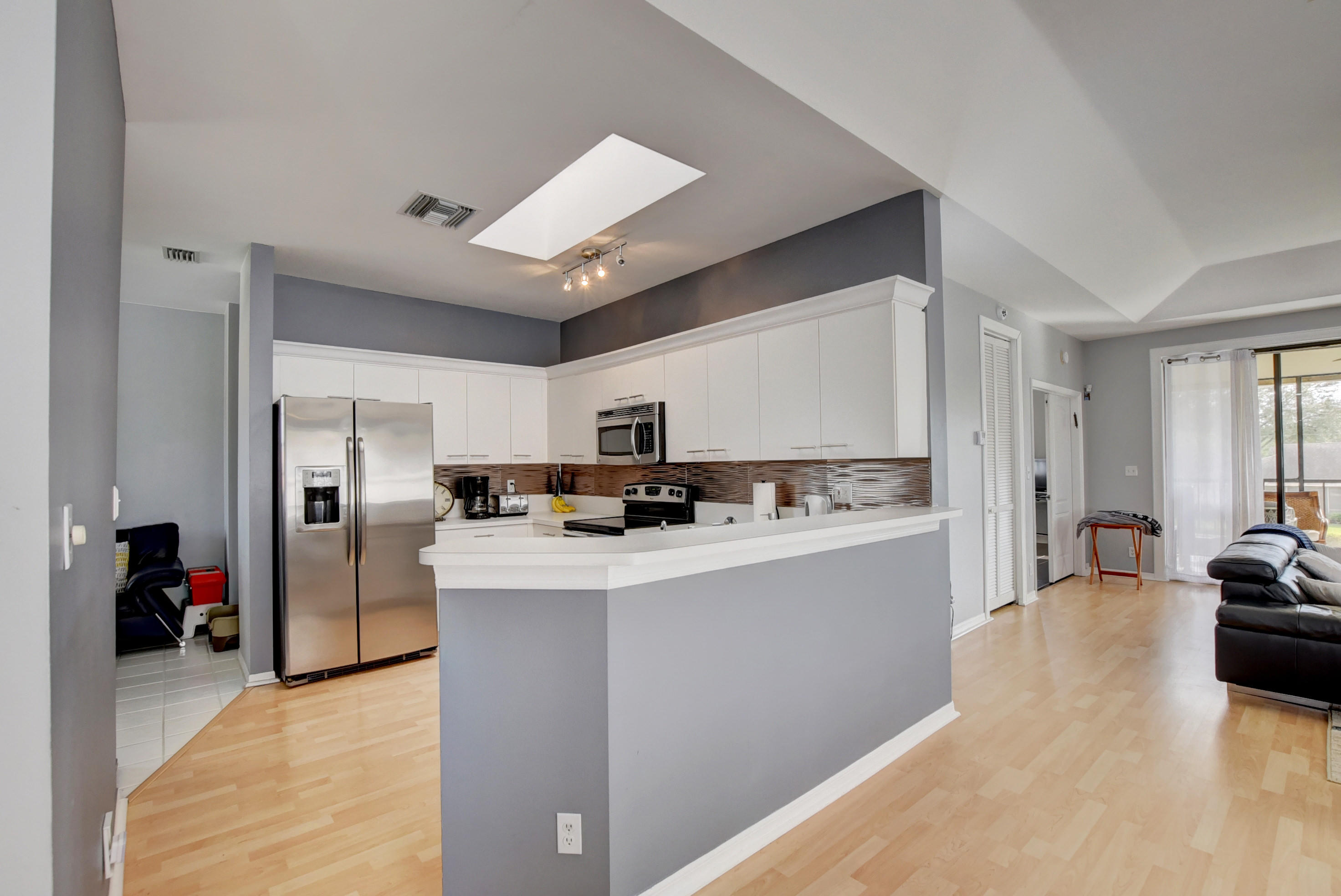 8682 Vía Reale, Unit 4 Boca Raton, FL 33496 - Photo 20 of 51 a view of kitchen with refrigerator stove and oven