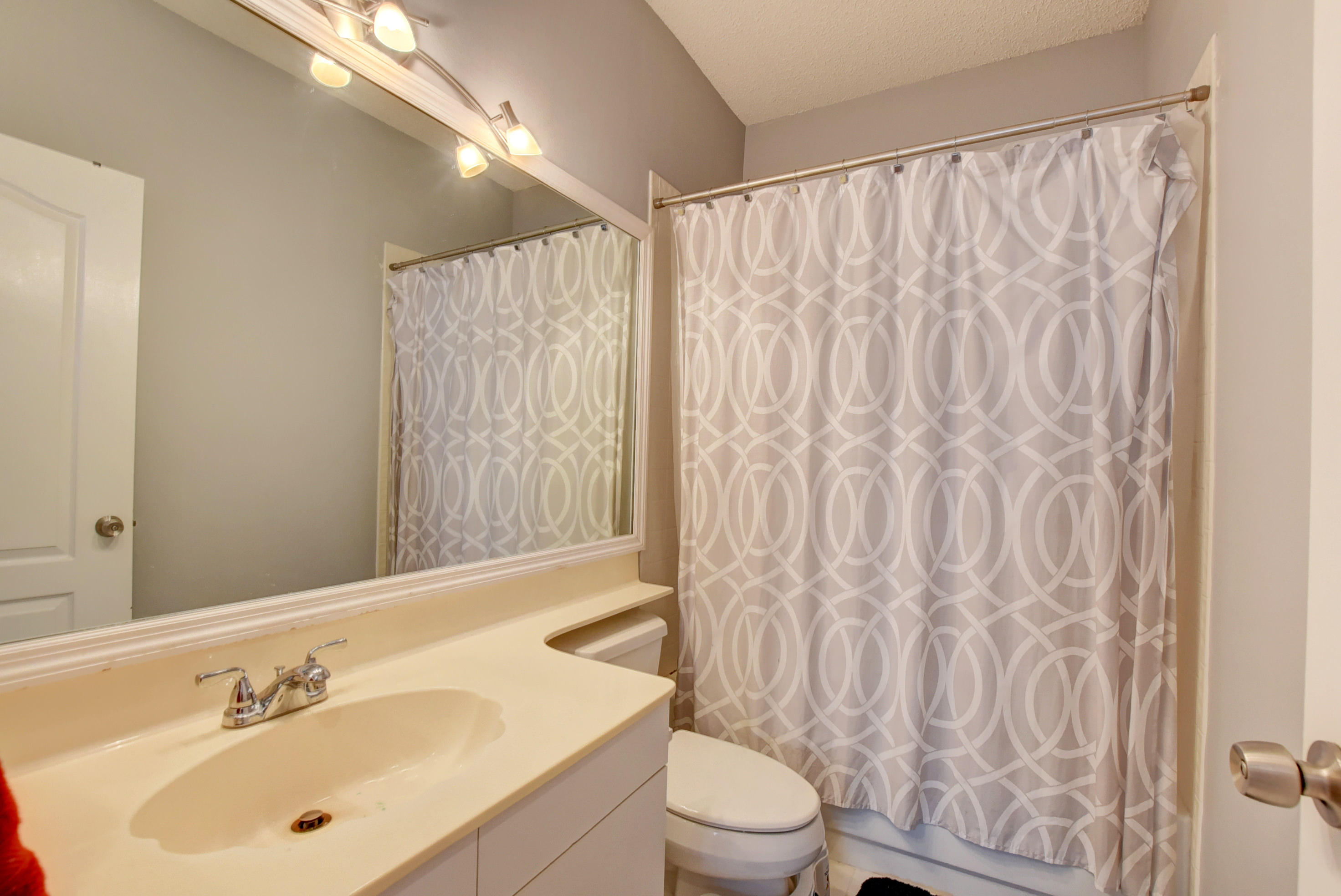 8682 Vía Reale, Unit 4 Boca Raton, FL 33496 - Photo 25 of 51 a bathroom with a sink and a mirror