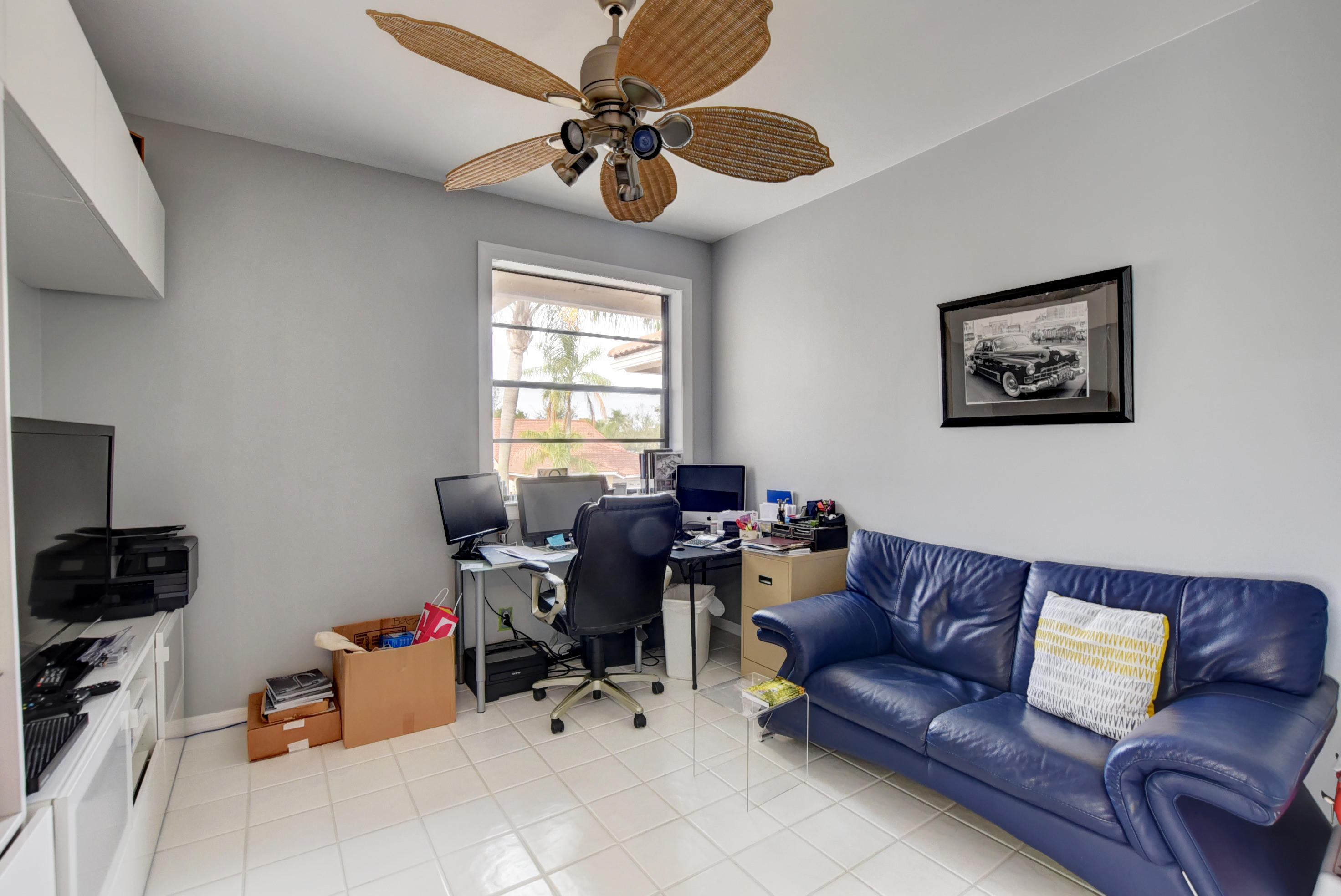 8682 Vía Reale, Unit 4 Boca Raton, FL 33496 - Photo 29 of 51 a living room with furniture and a window