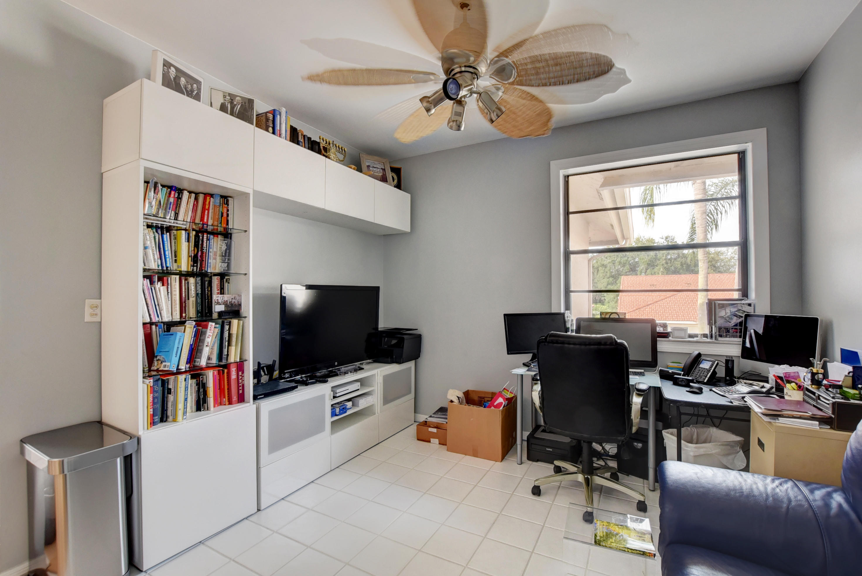8682 Vía Reale, Unit 4 Boca Raton, FL 33496 - Photo 30 of 51 a view of a livingroom with workspace and a window