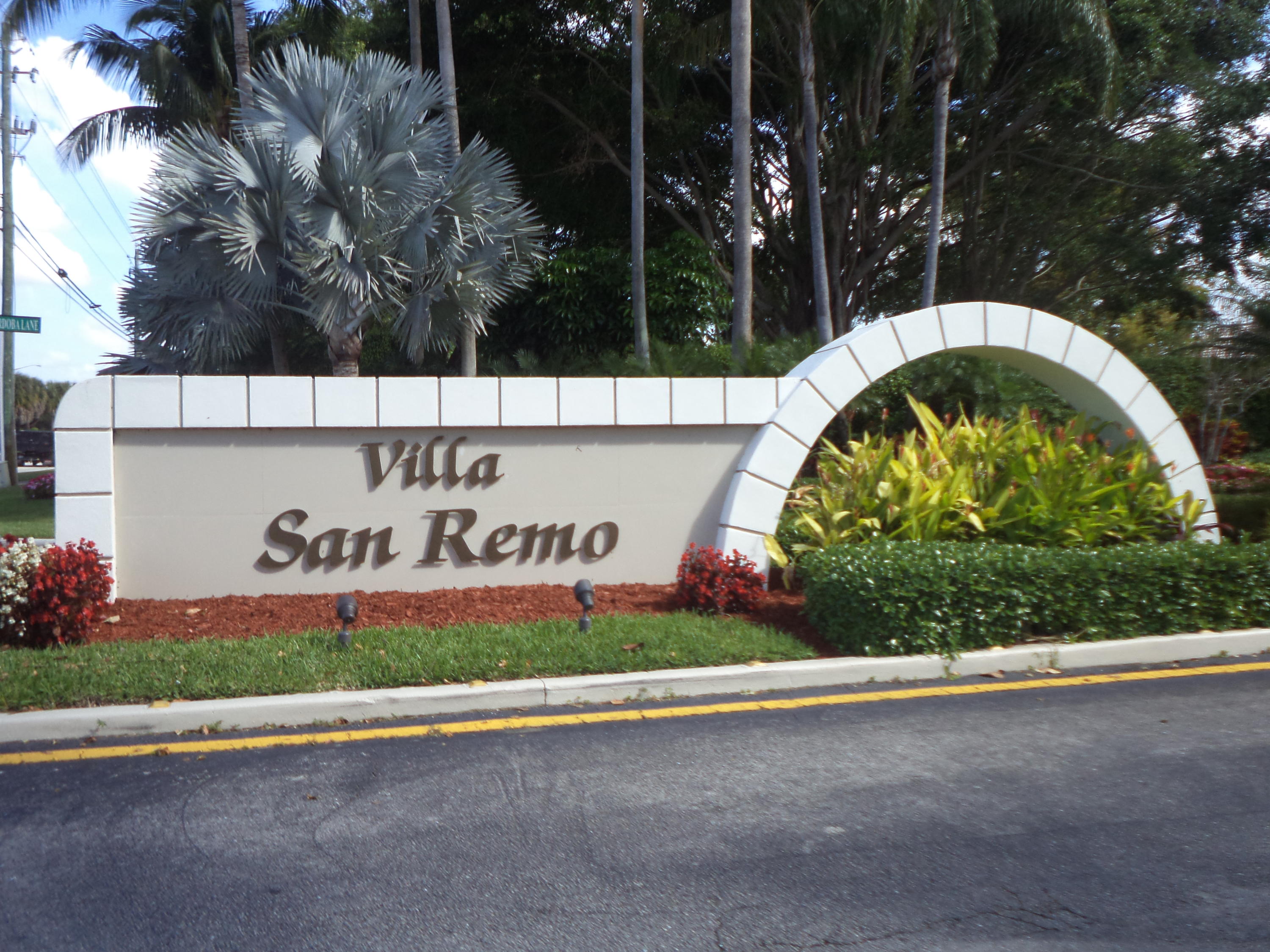 8682 Vía Reale, Unit 4 Boca Raton, FL 33496 - Photo 34 of 51 a sign that is sitting on the side of a road