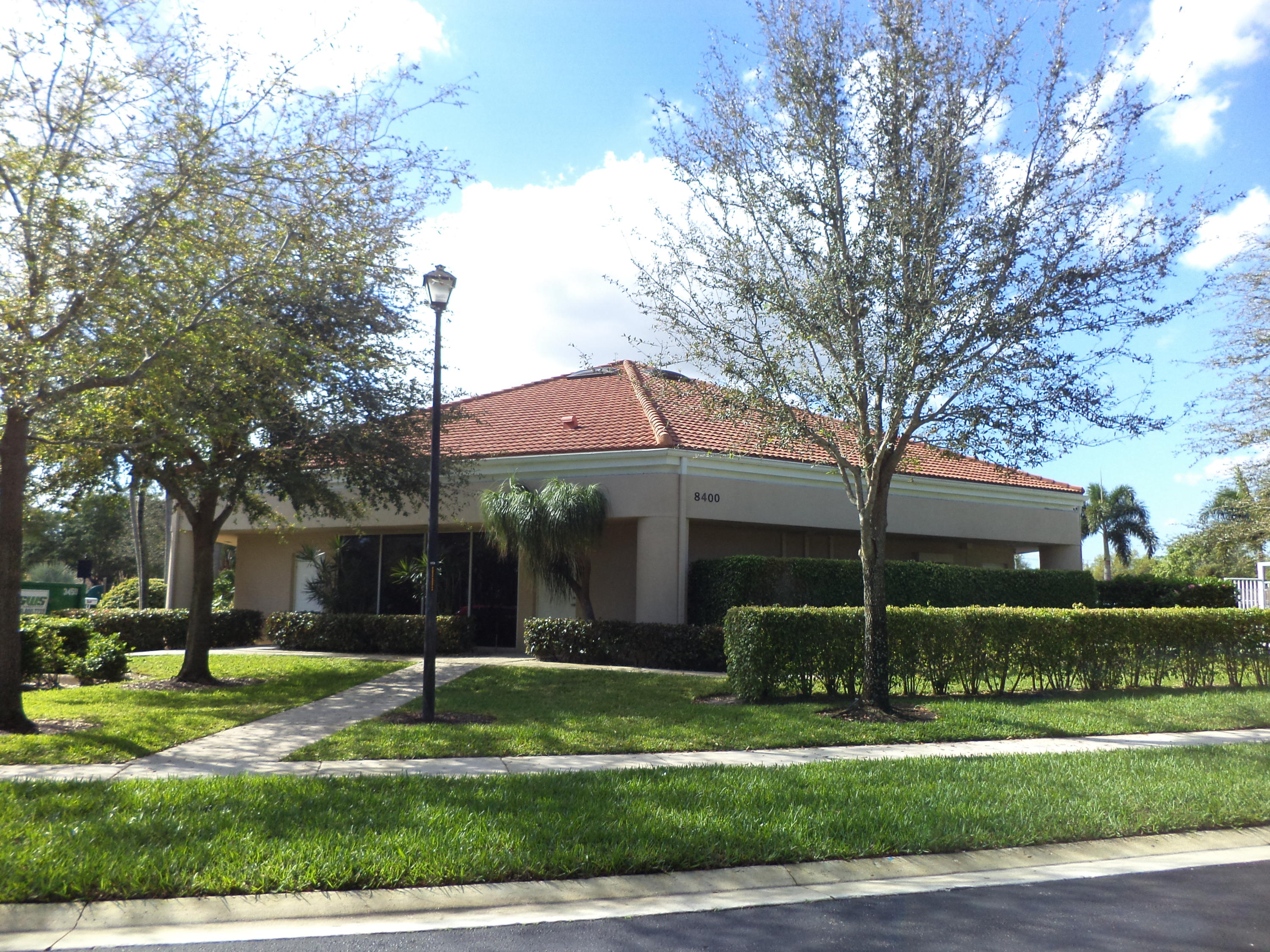 8682 Vía Reale, Unit 4 Boca Raton, FL 33496 - Photo 37 of 51 a front view of house with yard and green space