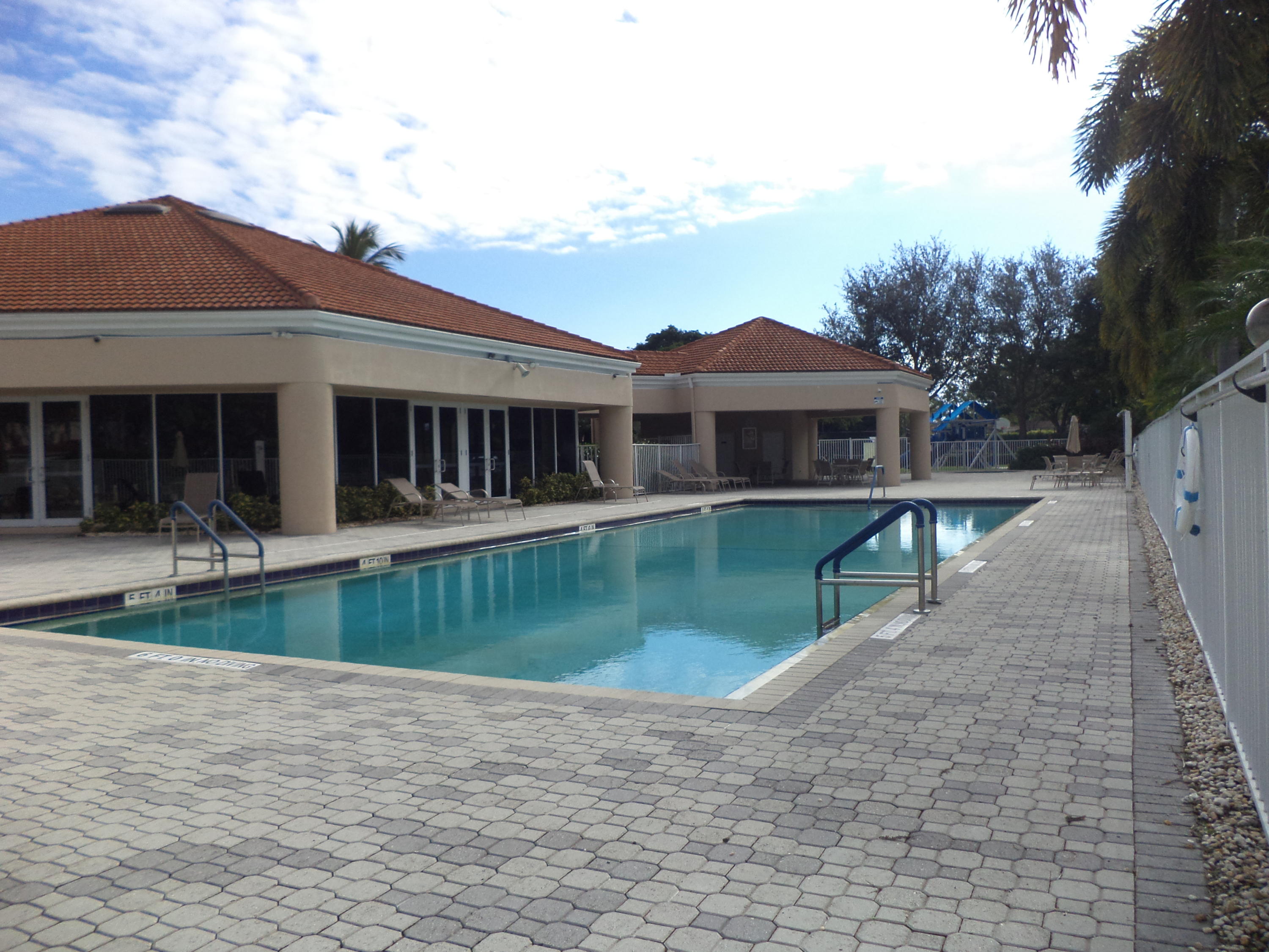 8682 Vía Reale, Unit 4 Boca Raton, FL 33496 - Photo 38 of 51 a view of a house with a yard