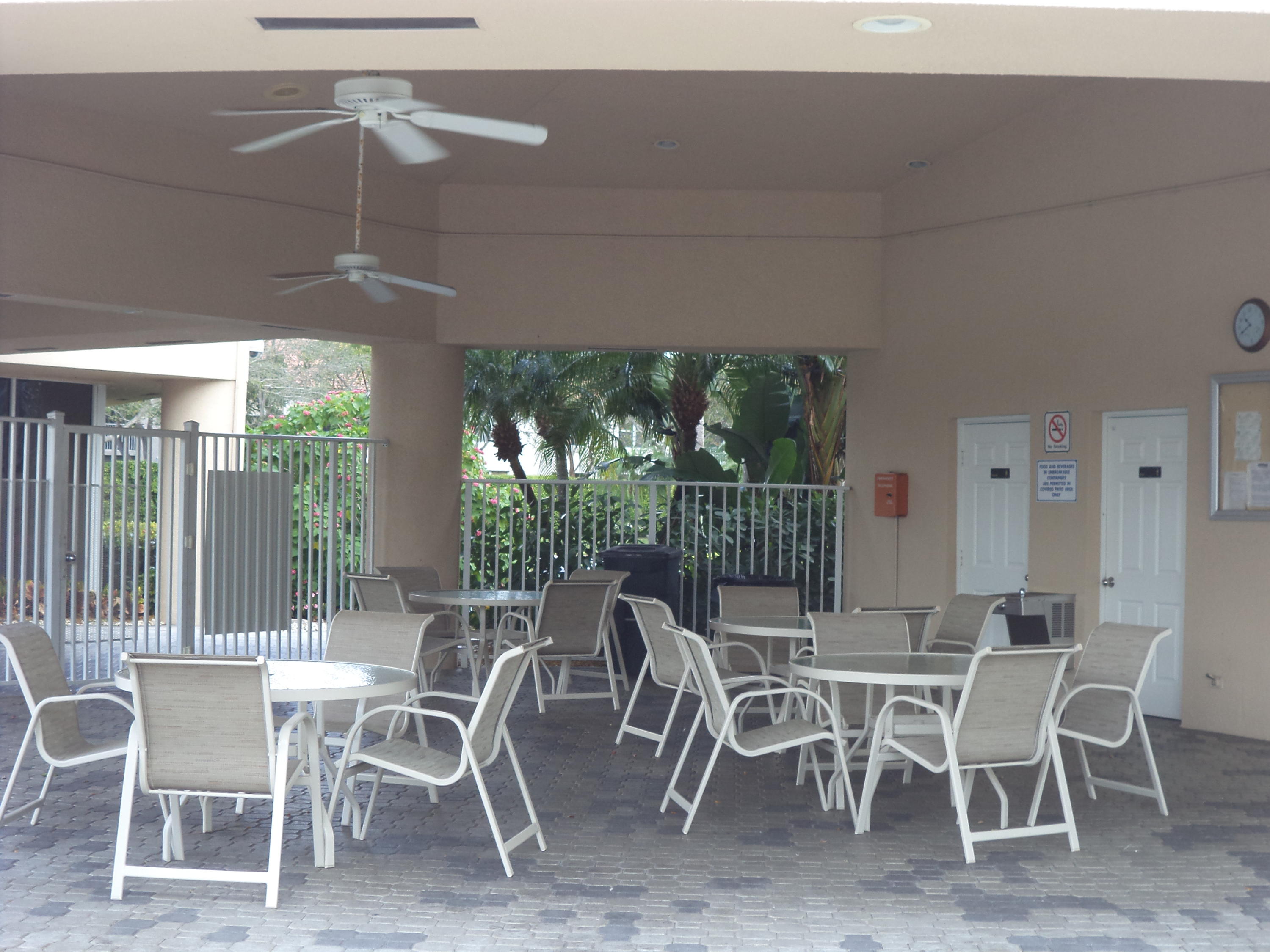 8682 Vía Reale, Unit 4 Boca Raton, FL 33496 - Photo 40 of 51 a view of a dining room with furniture window and outside view