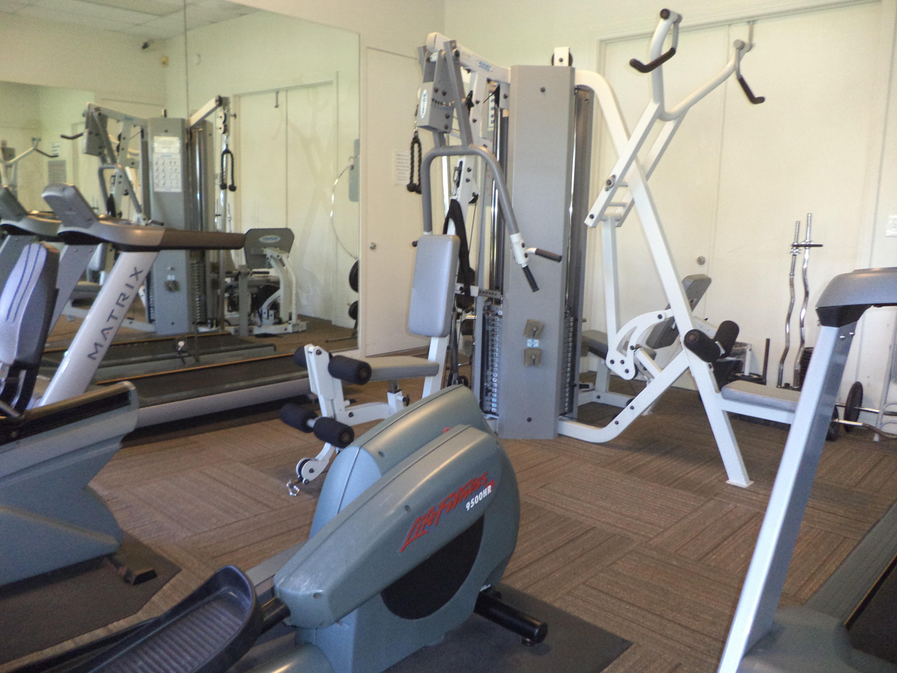 8682 Vía Reale, Unit 4 Boca Raton, FL 33496 - Photo 42 of 51 a room with gym equipment