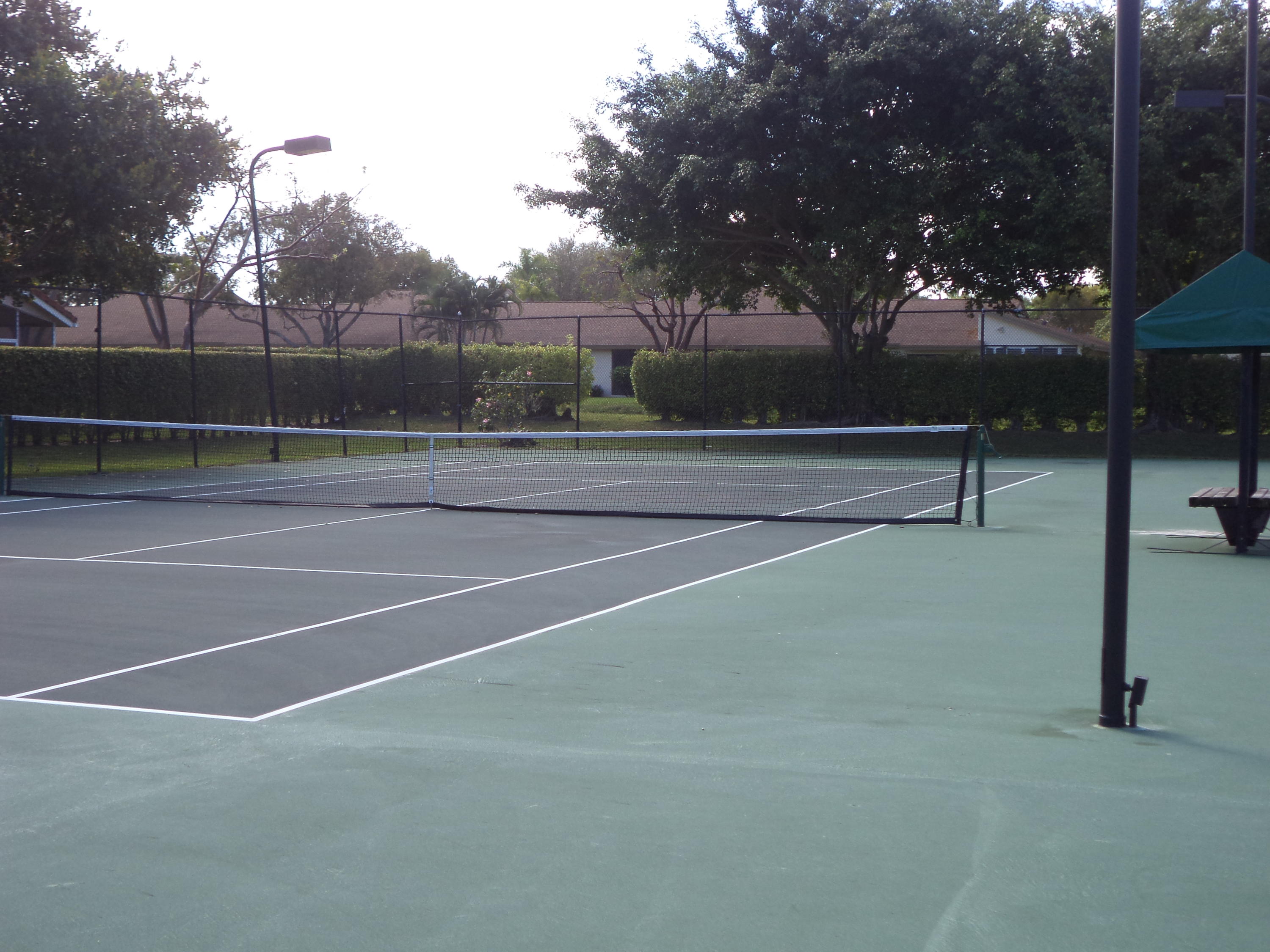 8682 Vía Reale, Unit 4 Boca Raton, FL 33496 - Photo 47 of 51 a view of outdoor space and tennis court