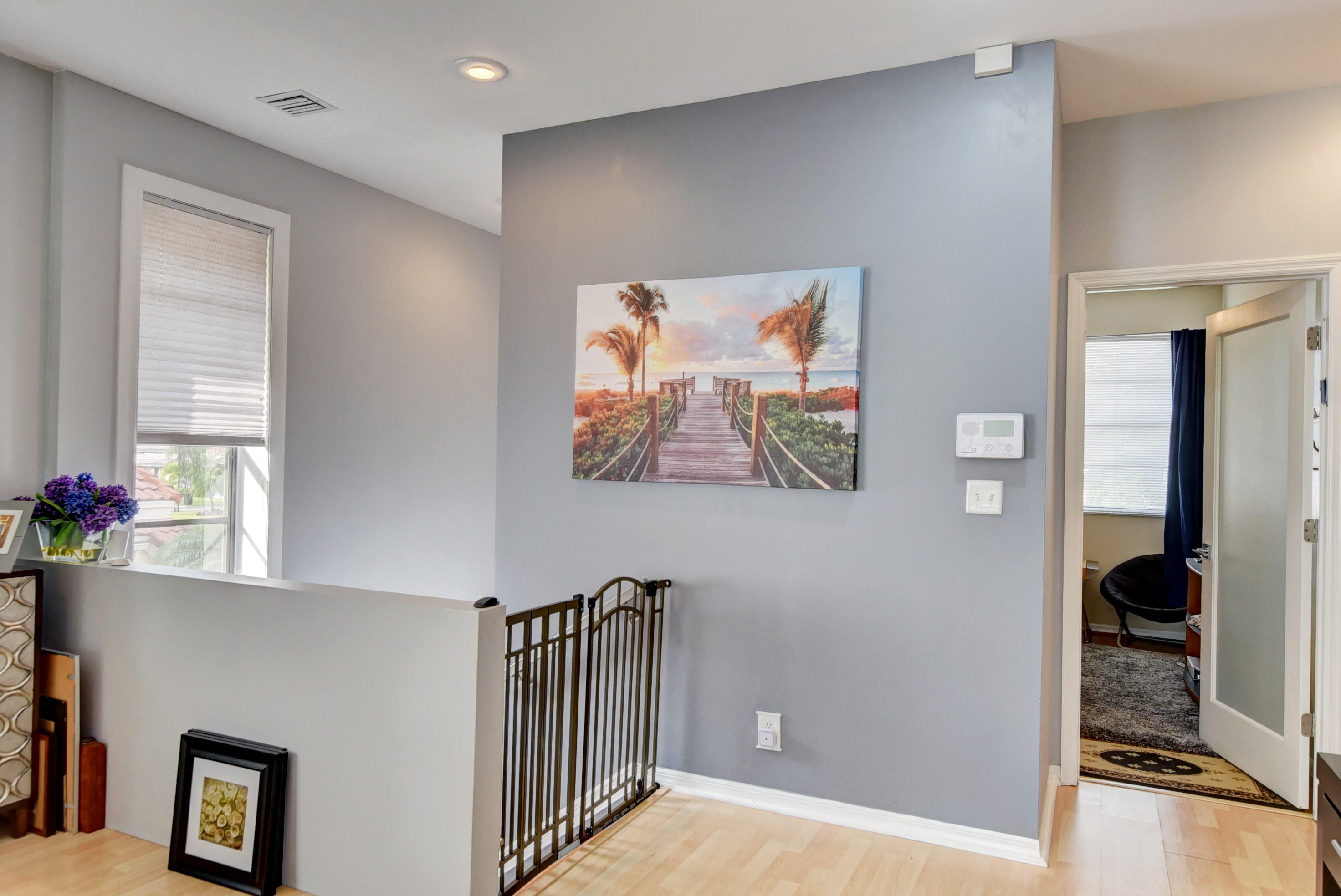 8682 Vía Reale, Unit 4 Boca Raton, FL 33496 - Photo 5 of 51 a view of a hallway with workspace
