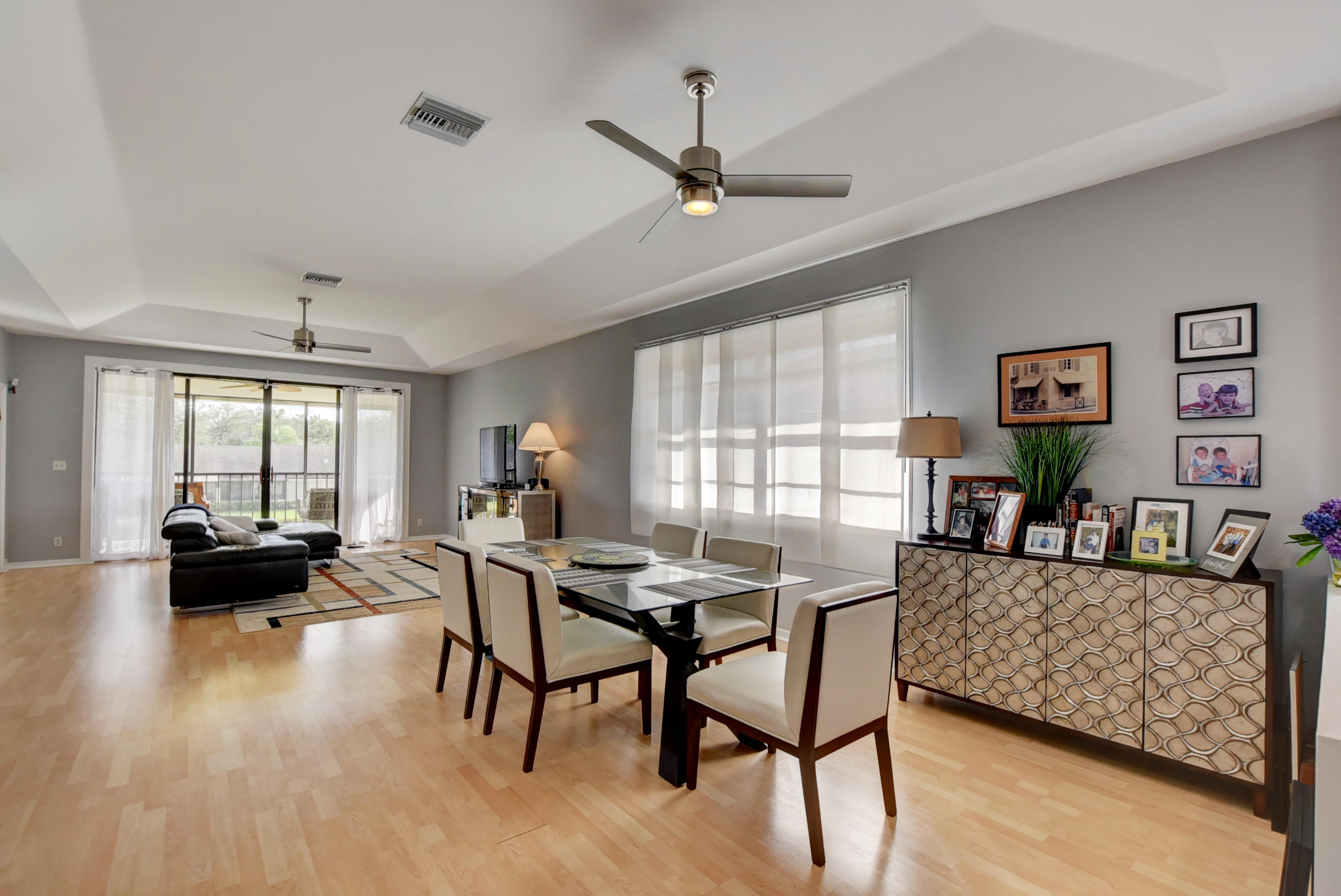 8682 Vía Reale, Unit 4 Boca Raton, FL 33496 - Photo 6 of 51 a living room with furniture and a large window