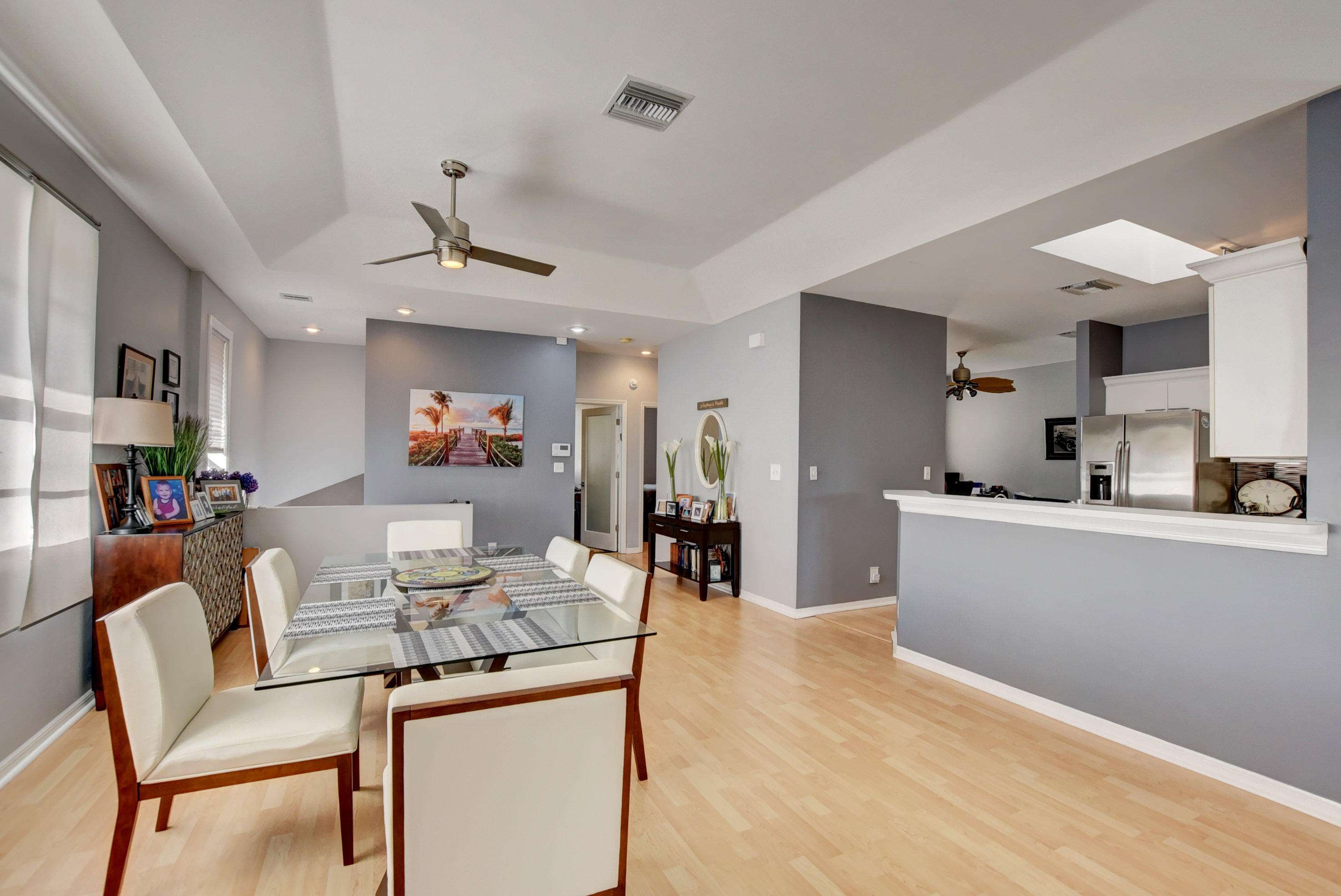 8682 Vía Reale, Unit 4 Boca Raton, FL 33496 - Photo 8 of 51 a living room with furniture and kitchen view